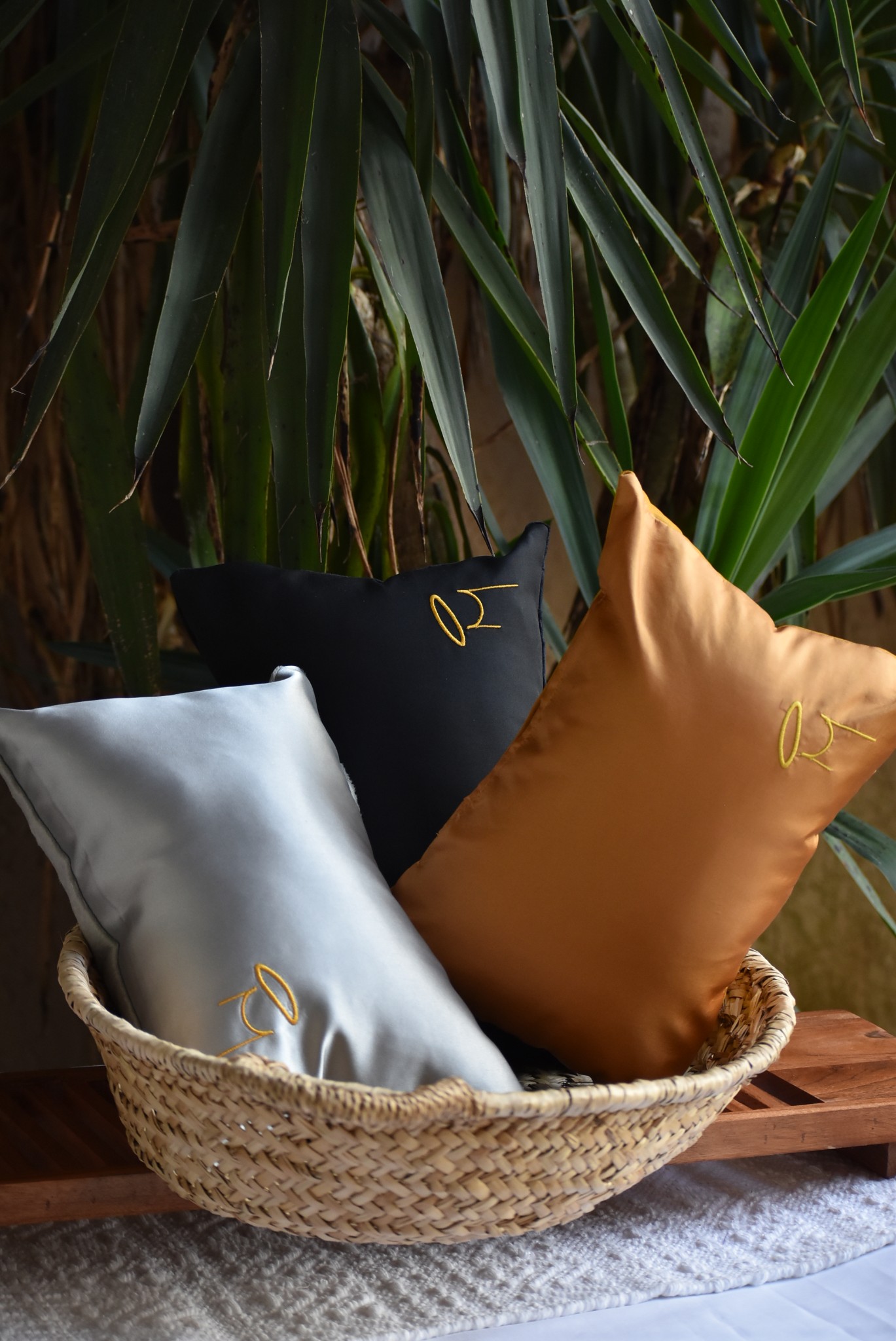 Make' logo pillows in basket